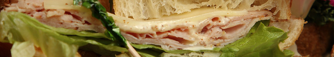 Eating Deli Sandwich at Windemere Marketplace and Deli restaurant in La Jolla, CA.